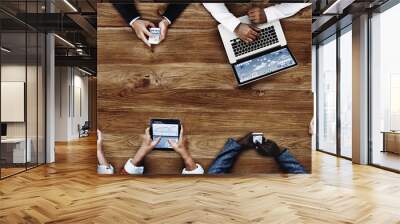 business people using mobile devices during meeting  Wall mural